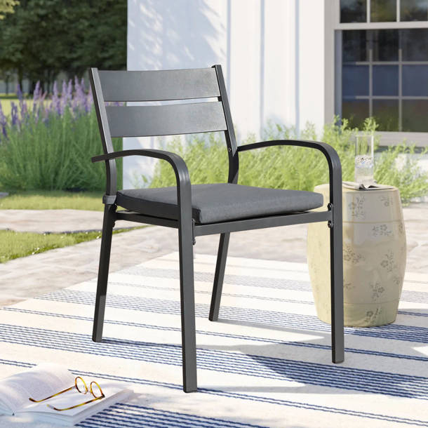 Lark Manor Fiskeville Patio Stacking Patio Dining Armchair with Cushion & Reviews Wayfair Canada